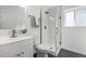 Stylish bathroom featuring modern fixtures, glass-enclosed shower, and sleek tile flooring at 4752 E 108Th Pl, Thornton, CO 80233