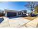 Charming gray two-story home with a blue garage door and shutters at 4752 E 108Th Pl, Thornton, CO 80233