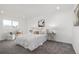 Bright bedroom features neutral decor, plush carpeting, and a comfortable seating area by the window at 4752 E 108Th Pl, Thornton, CO 80233