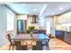 Modern kitchen featuring stainless steel appliances, and a rustic wooden table at 1245 Leyden St, Denver, CO 80220