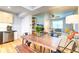 Open floor plan showing a modern kitchen next to the living and dining areas at 1245 Leyden St, Denver, CO 80220