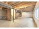 Unfinished basement with high ceilings and large windows at 20690 E 58Th Ave, Aurora, CO 80019