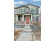 Two-story house with red front door and stone accents at 20690 E 58Th Ave, Aurora, CO 80019