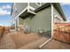 Rear exterior of house, showing unfinished yard and AC unit at 20690 E 58Th Ave, Aurora, CO 80019