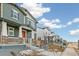 Row of houses with gray siding and red doors at 20690 E 58Th Ave, Aurora, CO 80019