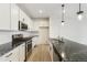 Modern kitchen with stainless steel appliances and granite countertops at 20690 E 58Th Ave, Aurora, CO 80019