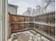 Enclosed backyard featuring a weathered wood fence and a concrete patio at 10001 E Evans Ave # 81C, Aurora, CO 80247