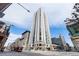 A tall modern building with many windows is on a city street with crosswalks and other buildings nearby at 1625 Larimer St # 2501, Denver, CO 80202