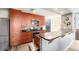 Modern kitchen featuring stainless steel appliances, sleek countertops, and stylish wooden cabinets with ample storage space at 1625 Larimer St # 2501, Denver, CO 80202