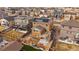 Aerial view of the house's backyard showing a wooden deck, solar panels on the roof and wooden fence at 11828 Churchfield St, Parker, CO 80134