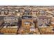 Aerial view of the house's backyard showing a wooden deck and solar panels on the roof at 11828 Churchfield St, Parker, CO 80134