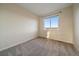 Neutral bedroom featuring plush carpeting and a bright window with neighborhood views at 11828 Churchfield St, Parker, CO 80134