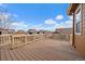 Spacious deck with wood flooring and railing, perfect for outdoor entertaining at 11828 Churchfield St, Parker, CO 80134