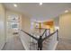 Upstairs hallway with a view of the lower level and a bedroom at 11828 Churchfield St, Parker, CO 80134