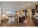 Spacious kitchen with a large center island, stainless steel appliances, and modern finishes at 11828 Churchfield St, Parker, CO 80134