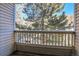 Private balcony overlooking a tree and neighboring buildings at 979 S Miller St # 202, Lakewood, CO 80226