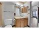 Clean bathroom with vanity, toilet and shower/tub combo at 979 S Miller St # 202, Lakewood, CO 80226