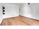 Bright bedroom with wood-look floors and an exterior door at 979 S Miller St # 202, Lakewood, CO 80226