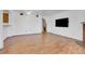 Living room with brick fireplace and wood floors at 979 S Miller St # 202, Lakewood, CO 80226