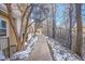 Paved walkway beside building and wooded area at 979 S Miller St # 202, Lakewood, CO 80226
