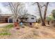 An outdoor shot of the backyard with a well-maintained lawn and patio area, perfect for entertaining at 1270 Elmira St, Aurora, CO 80010