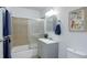 Cozy bathroom with shower, vanity, medicine cabinet and towel rack with modern fixtures at 1270 Elmira St, Aurora, CO 80010