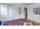 Bright bedroom featuring wood floors, closet, and doorway, for easy access to other areas of the house at 1270 Elmira St, Aurora, CO 80010