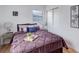 Well-lit bedroom featuring a comfortable bed, hardwood floors, and closet storage at 1270 Elmira St, Aurora, CO 80010