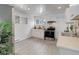 Spacious kitchen featuring stainless steel appliances, white cabinetry, and ample natural light at 1270 Elmira St, Aurora, CO 80010
