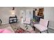 Open-concept living space featuring wood floors, stylish furnishings, and lots of light at 1270 Elmira St, Aurora, CO 80010