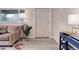 Bright living room featuring wood floors, a cozy couch, and an entryway to a bedroom at 1270 Elmira St, Aurora, CO 80010