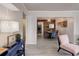 Bright, open-concept living space with wood floors, stylish furnishings, and decorative ceiling at 1270 Elmira St, Aurora, CO 80010