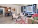 Cozy living room featuring built-in shelves and adjacent dining space with modern furnishings at 1270 Elmira St, Aurora, CO 80010