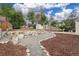 Landscaped backyard with gravel path, mulch, and rock accents creating a serene outdoor space at 116 N Gilbert St, Castle Rock, CO 80104