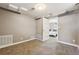 Cozy bedroom showcasing neutral walls, soft carpet, and easy access to other room at 116 N Gilbert St, Castle Rock, CO 80104