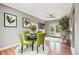 Cozy dining room features hardwood floors, modern light fixture, round table, and lots of natural light at 116 N Gilbert St, Castle Rock, CO 80104