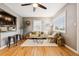 Comfortable living room with hardwood floors, a neutral color scheme, and an open layout connecting to the kitchen at 116 N Gilbert St, Castle Rock, CO 80104