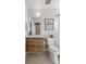 Bathroom featuring wood vanity, large mirror and a toilet at 1810 Irving St # 8, Denver, CO 80204
