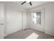 Bright bedroom with carpet flooring and a large window with roller shades at 1810 Irving St # 8, Denver, CO 80204