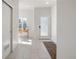 Modern entryway with tiled floor, a work desk, and a front door at 1810 Irving St # 8, Denver, CO 80204