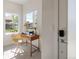 Bright home office area featuring large windows and a modern desk, perfect for remote work at 1810 Irving St # 8, Denver, CO 80204