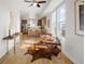 Open-concept living area flows into kitchen with an island, hardwood floors, and bright, airy windows at 1810 Irving St # 8, Denver, CO 80204