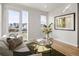 Stylish living room with modern furnishings, a glass coffee table, and balcony access with city views at 1810 Irving St # 8, Denver, CO 80204