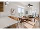 Bright living room featuring hardwood floors, modern furnishings, and abundant natural light from large windows at 1810 Irving St # 8, Denver, CO 80204
