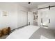 Spacious and bright bedroom with a view to the ensuite bathroom with a shower at 1810 Irving St # 8, Denver, CO 80204