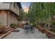 Backyard patio with outdoor dining set, perfect for enjoying the serene surroundings and fresh air at 1298 Meadow View Dr, Evergreen, CO 80439