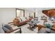 Inviting basement living room with modern furnishings, neutral tones, and a convenient adjacent bathroom at 1298 Meadow View Dr, Evergreen, CO 80439