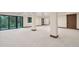 Unfinished basement featuring large windows, neutral carpet, and ample space for customization at 1298 Meadow View Dr, Evergreen, CO 80439