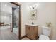 Charming bathroom with chevron wood cabinet, vessel sink, black faucet, and mosaic tile at 1298 Meadow View Dr, Evergreen, CO 80439