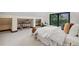 Bright bedroom with natural light, a walkout balcony, and additional nooks for storage and decoration at 1298 Meadow View Dr, Evergreen, CO 80439